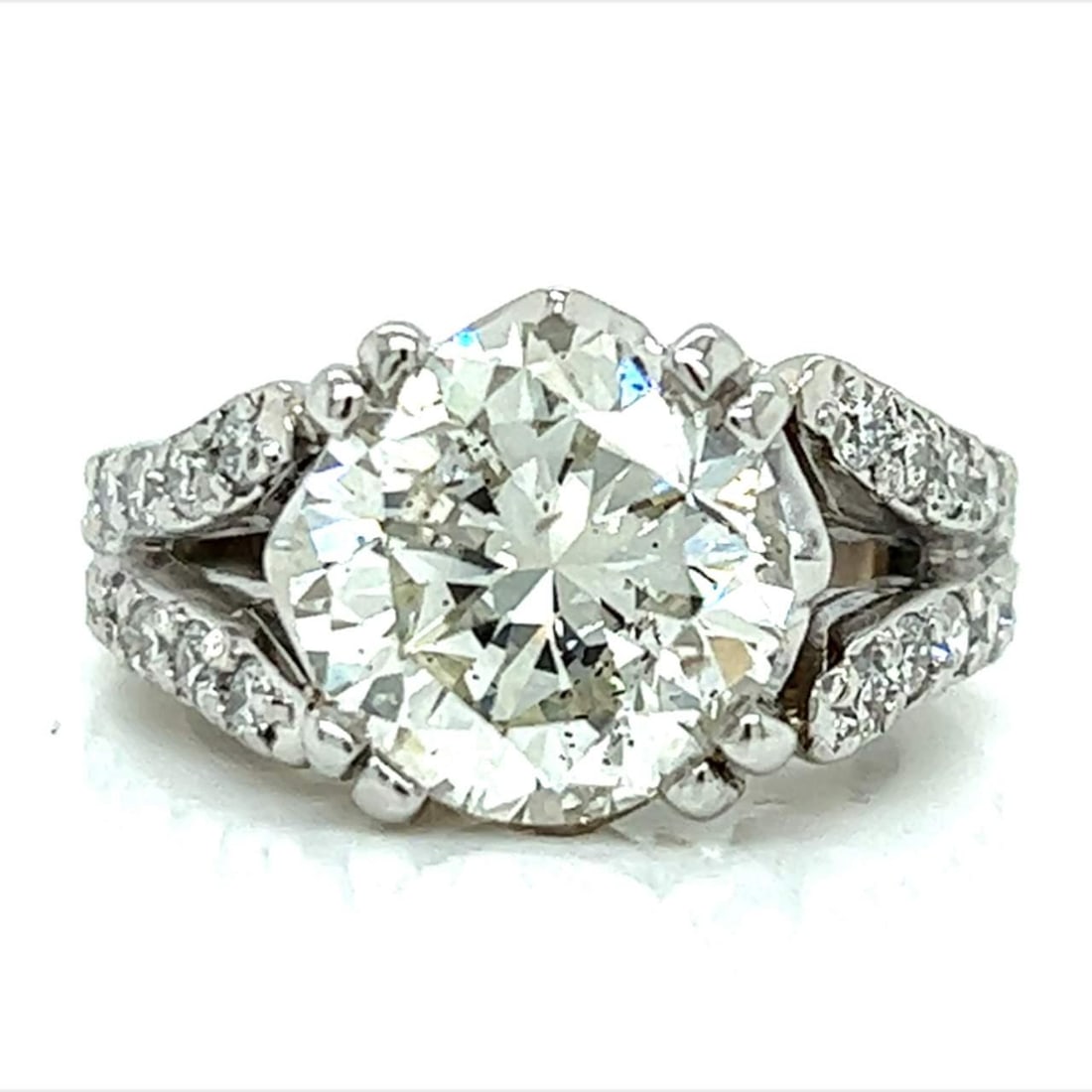 Platinum 4.90 Ct GIA Certified Round Brilliant Diamond Ring: Platinum 4.90 Ct GIA Certified Round Brilliant Diamond Ring This exquisite Platinum ring features a stunning GIA Certified 4.90 Ct. Round Brilliant Diamond, showcasing a captivating L color and I1 cla