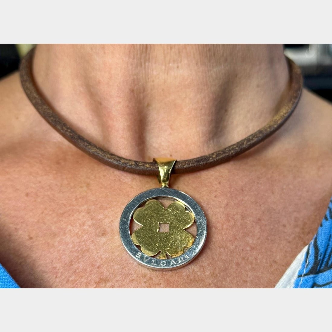 Necklace in 18K Yellow Gold and Stainless Steel by BVLGARI: Necklace in 18K Yellow Gold and Stainless Steel by BVLGARI This BVLGARI necklace features a pendant crafted from 18K yellow gold and stainless steel, weighing 24.2 grams. The pendant measures 1.75 inc