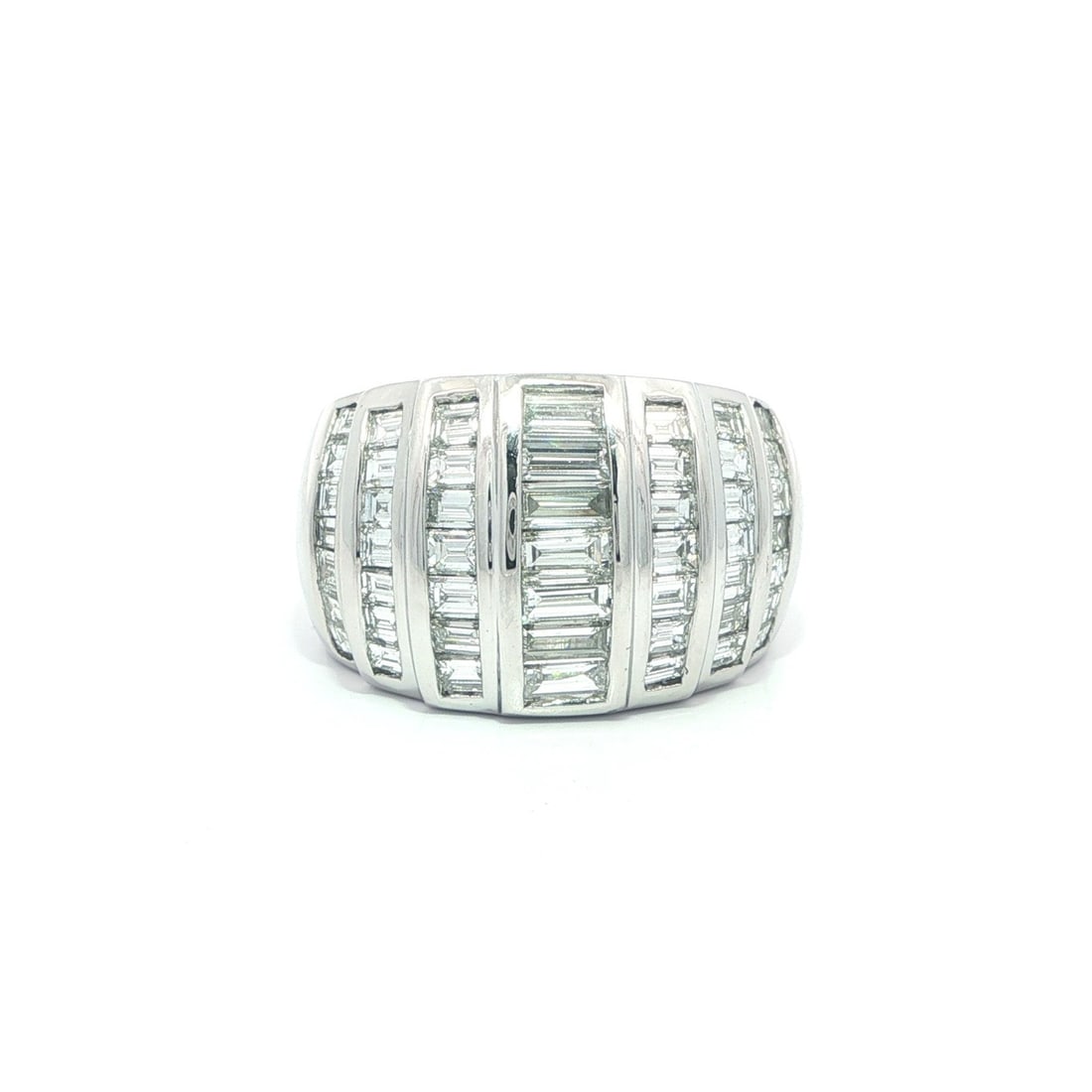 3.5ctw Baguette Diamond Platinum Wide Bombe Band Ring with Channel Setting: 3.5ctw Baguette Diamond Platinum Wide Bombe Band Ring with Channel Setting This heavy platinum bombe band ring features seven rows of channel-set, natural baguette-cut diamonds totaling approximately