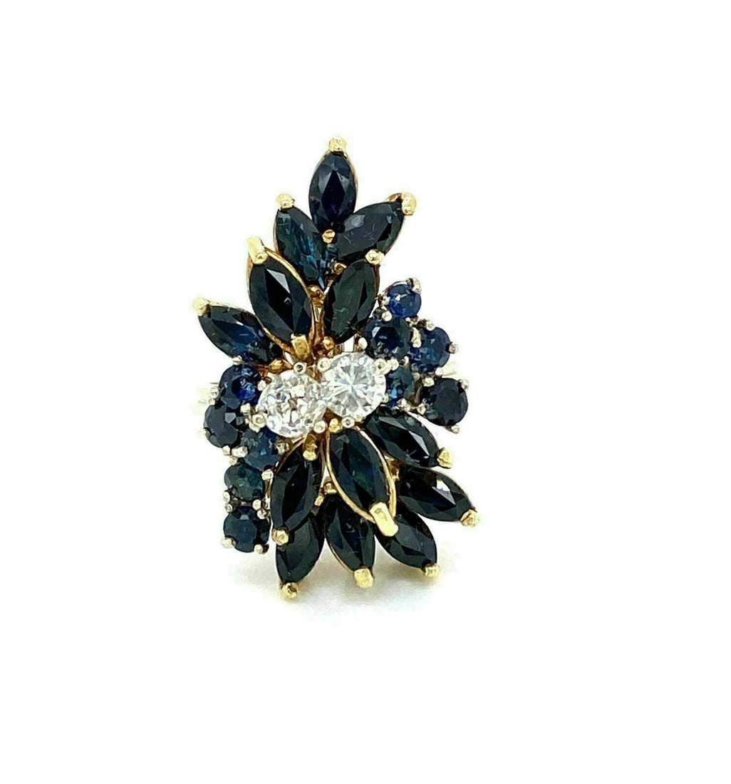 14k Two Tone Gold Cluster Ring with Diamonds and Sapphires Size 5.5: 14k Two Tone Gold Cluster Ring with Diamonds and Sapphires Size 5.5 This ring features a cluster design set with 0.50 carat total weight of diamonds and 2.50 carat total weight of sapphires in a 14k t