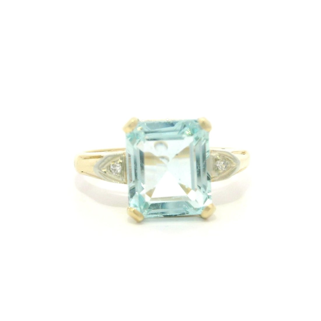 Vintage Yellow Gold 3.03ct Emerald Cut Aquamarine Ring with Diamond Accents: Vintage Yellow Gold 3.03ct Emerald Cut Aquamarine Ring with Diamond Accents This exquisite vintage ring features a stunning 3.03ct natural emerald cut aquamarine, beautifully prong set in a solid yell