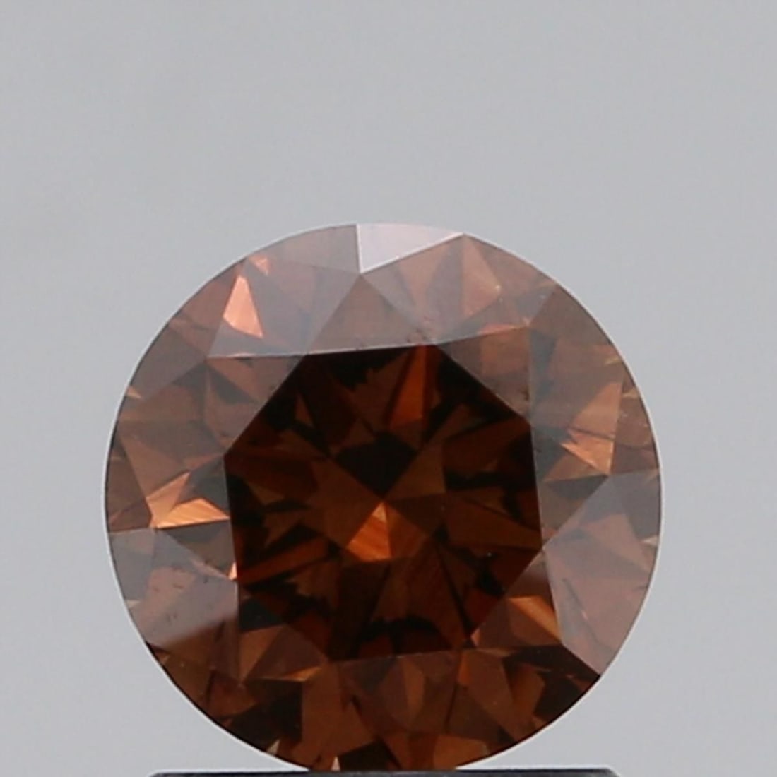 Loose Diamond - ROUND 1.2ct Fancy Dark Orangey Brown VVS2: Loose Diamond - ROUND 1.2ct Fancy Dark Orangey Brown VVS2 Source: Natural Shape: ROUND Carats: 1.2 Color: Fancy Dark Orangey Brown Certification: GIA Video: