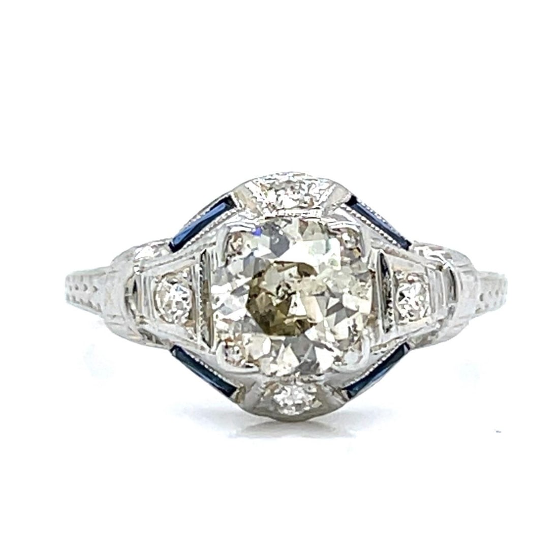 Art Deco 18K White Gold Diamond Ring 1.00 Ct with 4 Accent Diamonds: Art Deco 18K White Gold Diamond Ring 1.00 Ct with 4 Accent Diamonds This exquisite Art Deco ring features a stunning design crafted from 18K white gold. It is adorned with an approximately 1.00 Ct. ma
