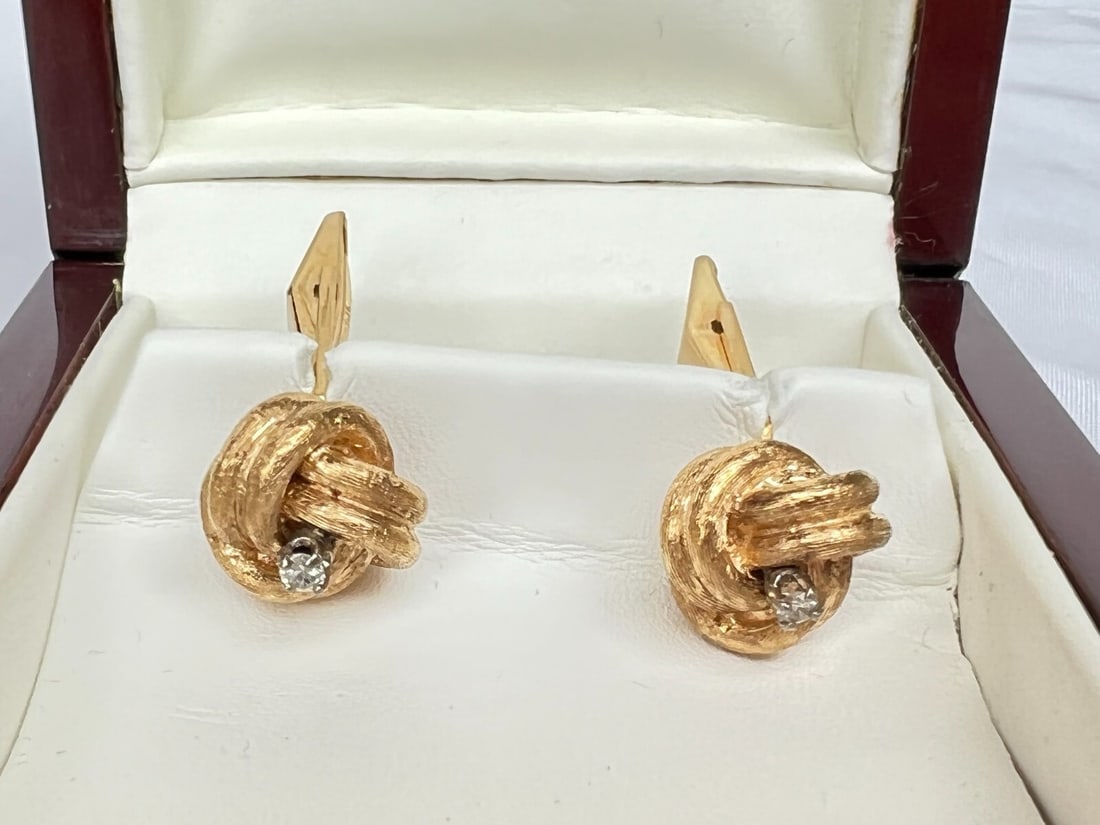 Two White Palladium and Diamond Cufflinks with 14K Yellow Gold Overlay: Two White Palladium and Diamond Cufflinks with 14K Yellow Gold Overlay This pair of cufflinks features white palladium construction with diamond accents and is stamped 14k, covered with yellow gold. T