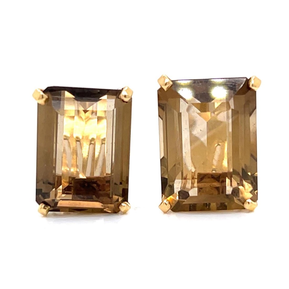 Pair of Retro Topaz Earrings in 14K Yellow Gold: Pair of Retro Topaz Earrings in 14K Yellow Gold These retro earrings are crafted from 14K yellow gold and feature two topaz gemstones with a combined weight of approximately 30.00 carats. The earrings