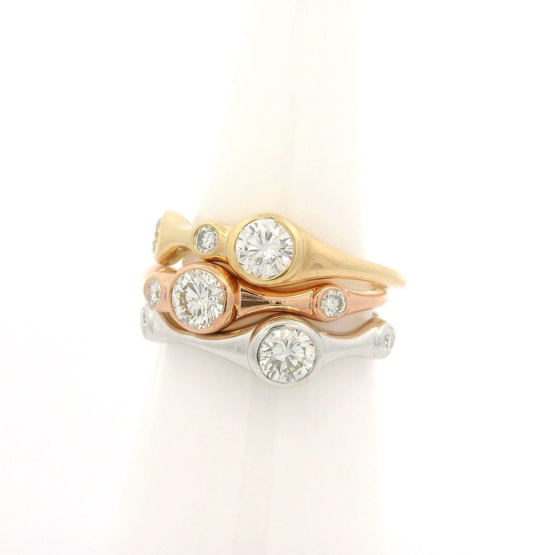 Set of 3 14k Tri Color Gold Diamond Stack Bands Rings 1.08ctw: Set of 3 14k Tri Color Gold Diamond Stack Bands Rings 1.08ctw This stunning set of three low profile stack bands rings features a beautiful tri-color gold design crafted from solid 14k yellow, rose, a