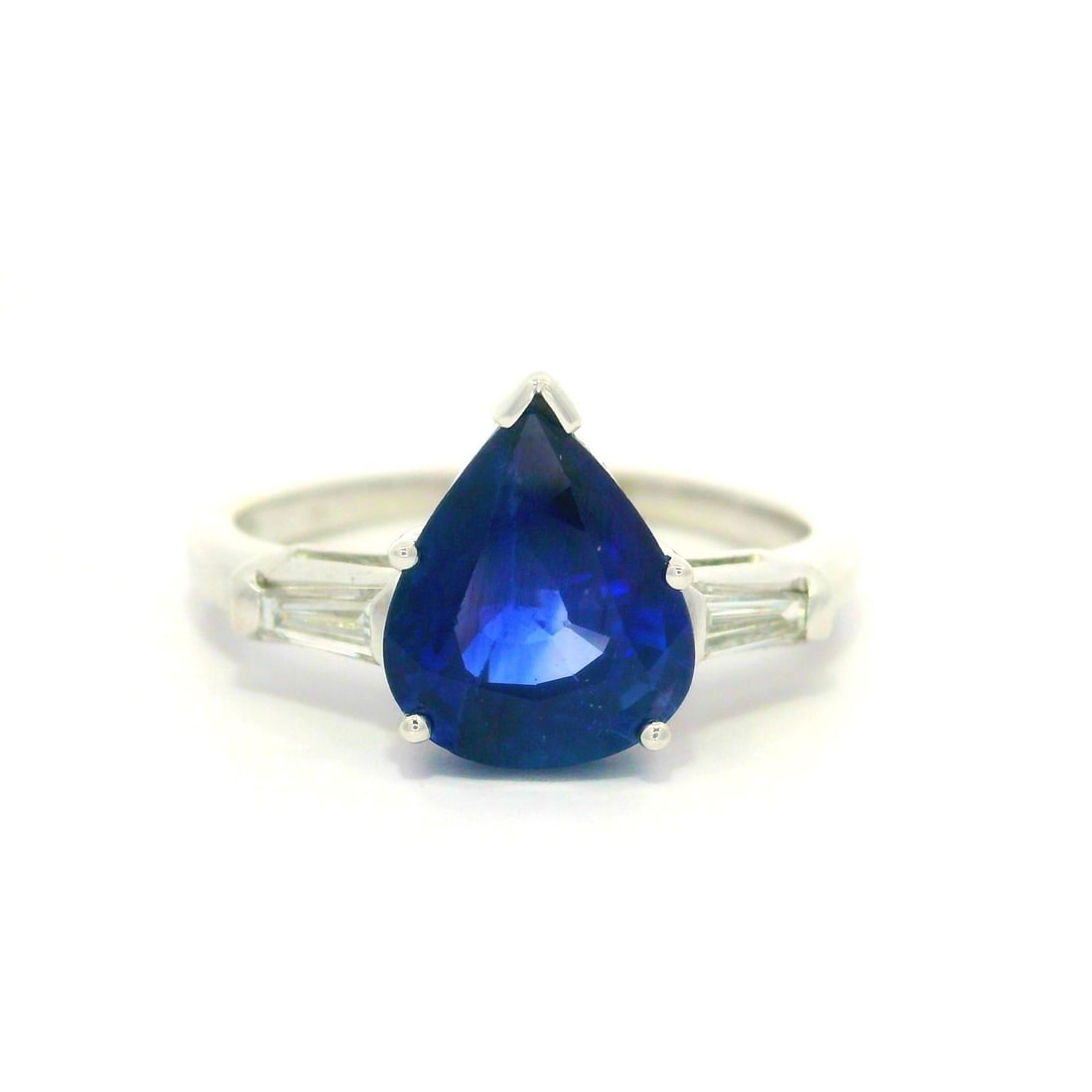 Vintage Platinum GIA Certified 2.82ct Pear Cut Sapphire Ring with Baguette Diamonds: Vintage Platinum GIA Certified 2.82ct Pear Cut Sapphire Ring with Baguette Diamonds This exquisite vintage cocktail ring features a stunning natural pear cut sapphire with a total carat weight of 2.57