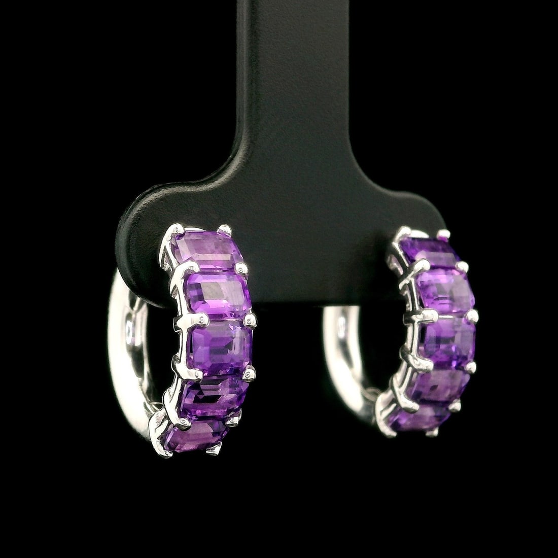 Custom 14k White Gold 2.01ct Amethyst Emerald Cut Huggie Hoop Earrings: Custom 14k White Gold 2.01ct Amethyst Emerald Cut Huggie Hoop Earrings Elevate your style with these exquisite custom huggie hoop earrings, crafted from solid 14k white gold. Featuring a stunning tota