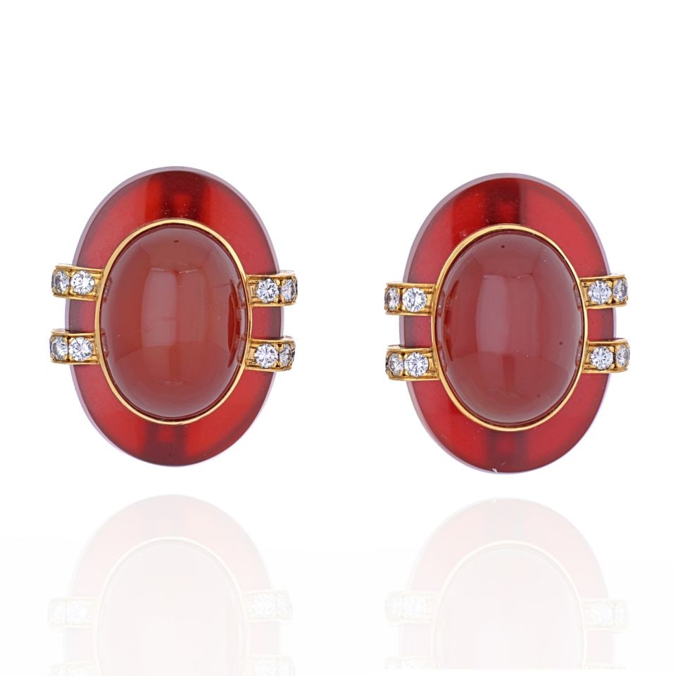 David Webb 18K Yellow Gold Carnelian Diamond Clip-On Earrings: David Webb 18K Yellow Gold Carnelian Diamond Clip-On Earrings Add a splash of elegance to your jewelry collection with these exquisite David Webb Bombe Earrings. Crafted from luxurious 18K yellow gold