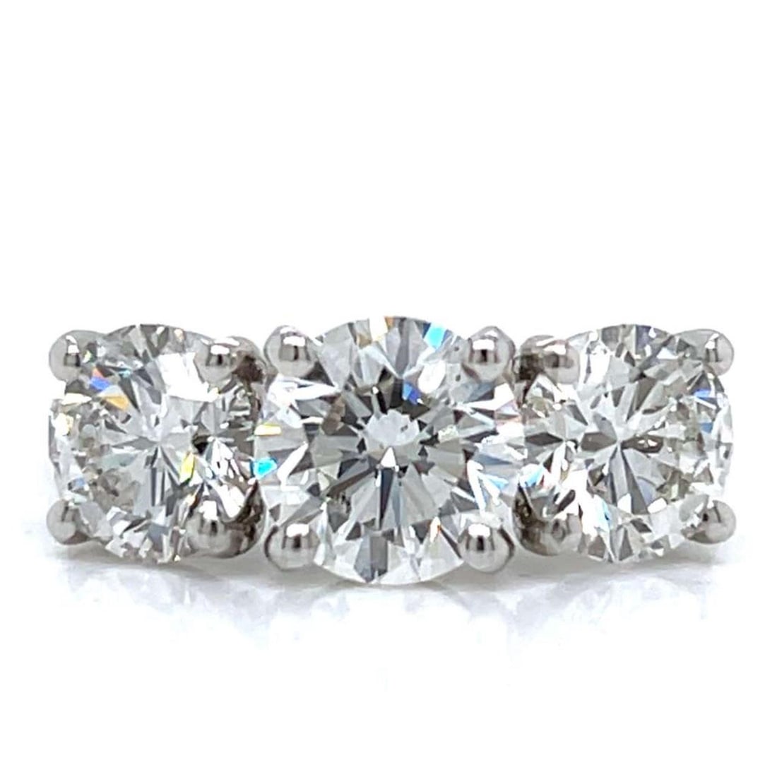Three Diamond Platinum Ring with GIA Certification and H VS2 Stones: Three Diamond Platinum Ring with GIA Certification and H VS2 Stones This platinum 3-stone diamond ring features three GIA certified diamonds: a 2.00 carat center stone and two side stones weighing 1.3