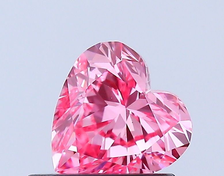 Loose Diamond - HEART 0.7ct Fancy Vivid Pink VS1: Loose Diamond - HEART 0.7ct Fancy Vivid Pink VS1 Source: This is a real non-mined Diamond that has been grown in a lab Shape: HEART Carats: 0.7 Color: Fancy Vivid Pink Certification: IGI Video: