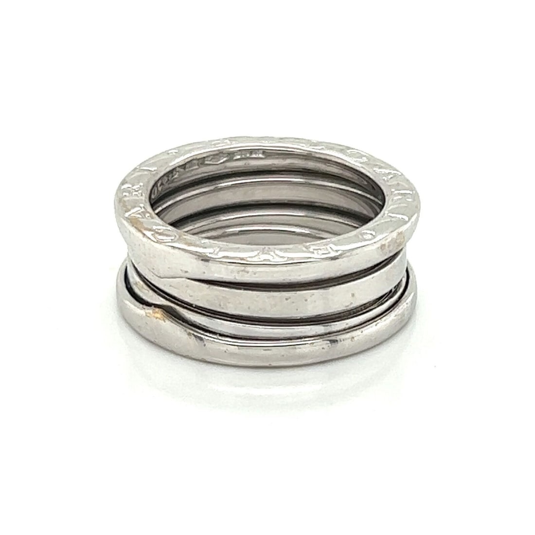 B.zero1 18k White Gold Three-Band Ring by Bvlgari Size 5: B.zero1 18k White Gold Three-Band Ring by Bvlgari Size 5 This authentic Bvlgari B.zero1 three-band ring showcases modern Italian design, expertly crafted in solid 18k white gold with a high-polished f