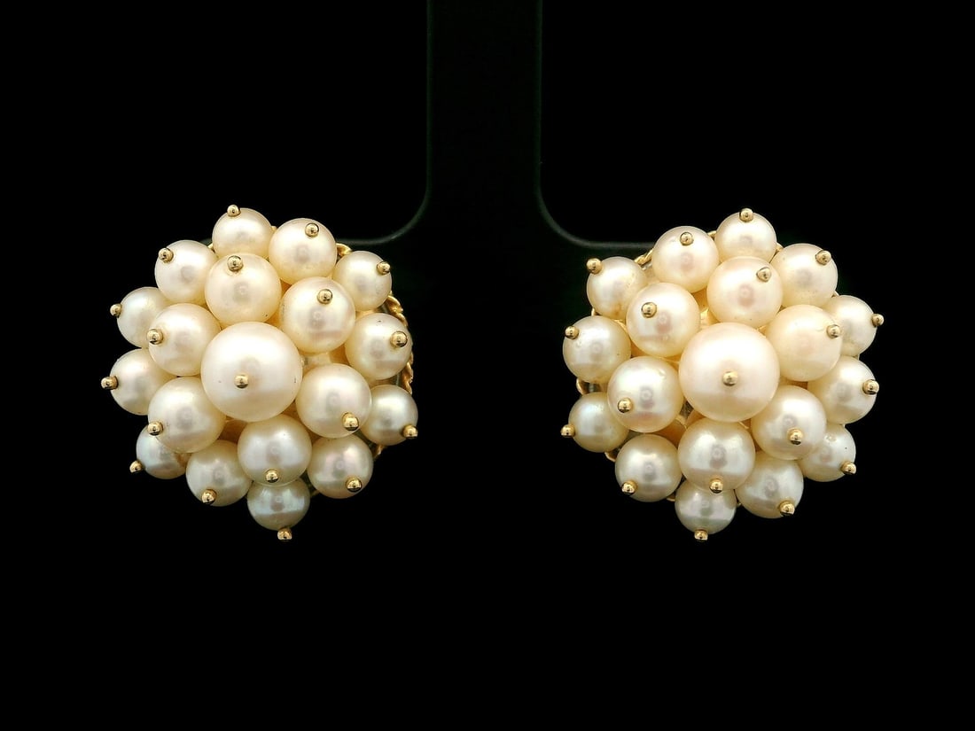 Vintage 14k Yellow Gold Cultured Pearl Clip-On Sputnik Earrings: Vintage 14k Yellow Gold Cultured Pearl Clip-On Sputnik Earrings These vintage clip-on earrings feature a stunning cluster design showcasing numerous genuine cultured pearls. The pearls, in round shape