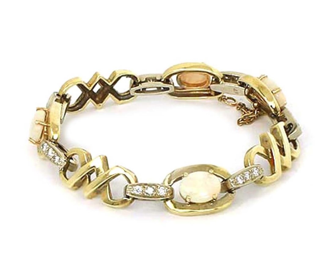 Estate 14k Yellow White Gold Opal and Diamond Fancy Link Bracelet: Estate 14k Yellow White Gold Opal and Diamond Fancy Link Bracelet This estate bracelet features a classic fancy link design crafted in solid 14k yellow and white gold, set with alternating opals and d