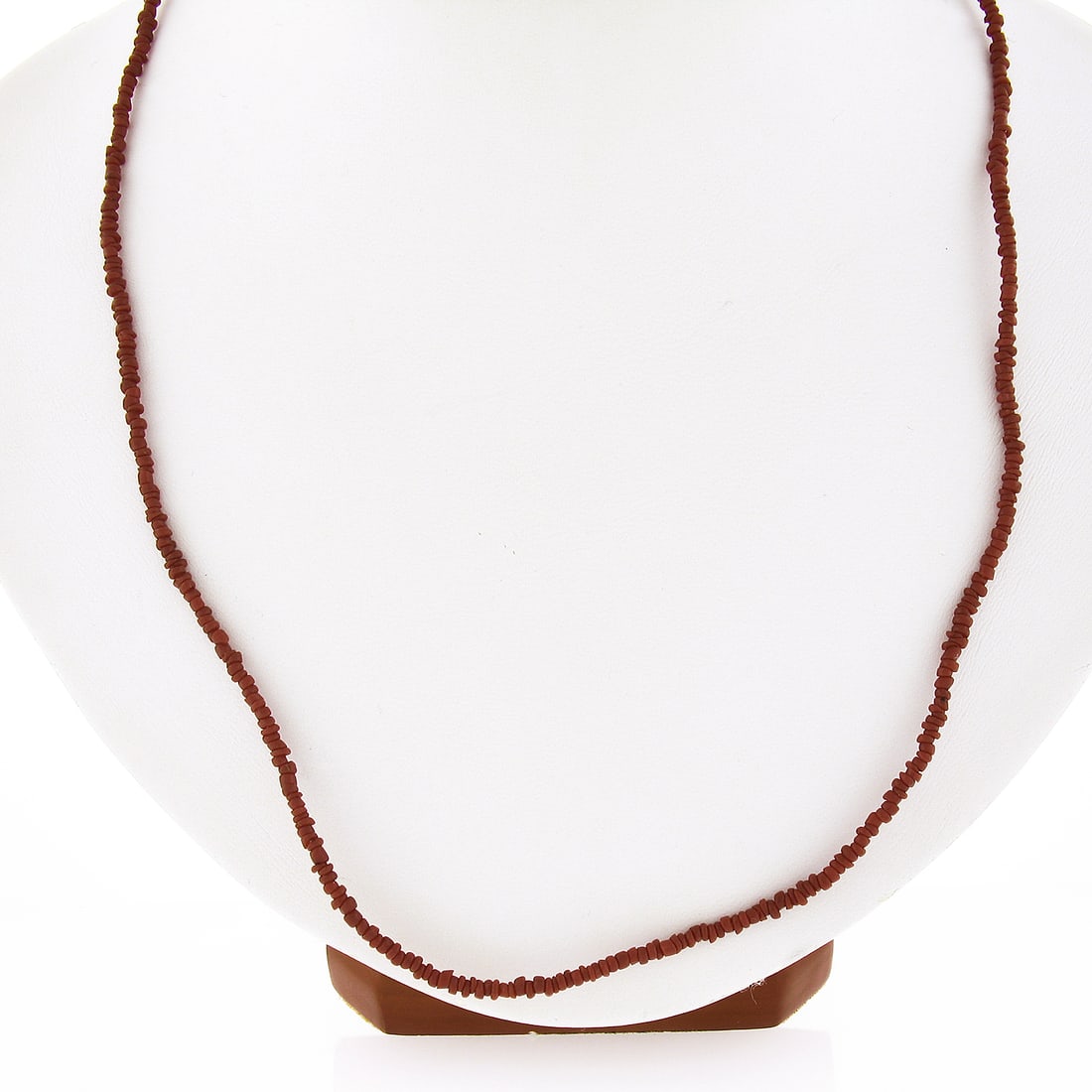 20 Inch Tumbled Coral Necklace with 14k Yellow Gold Ends: 20 Inch Tumbled Coral Necklace with 14k Yellow Gold Ends Adorn yourself with this exquisite 20-inch bead narrow tumbled coral strand necklace, featuring striking red coral stones complemented by solid
