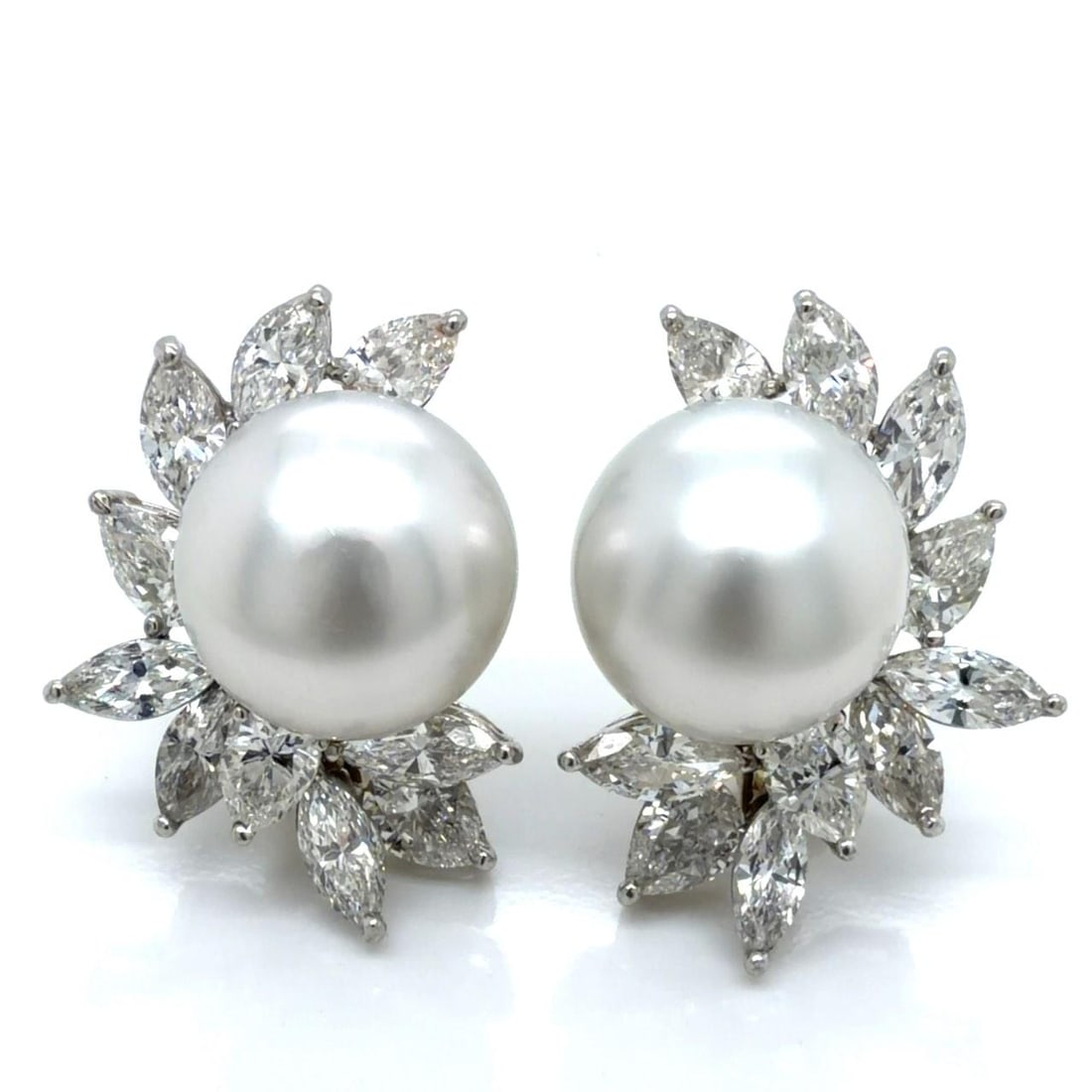 South Sea Pearl and Diamond Earrings in Platinum and 18K White Gold: South Sea Pearl and Diamond Earrings in Platinum and 18K White Gold These elegant earrings feature two South Sea pearls, each measuring approximately 14.86 to 14.75mm, set in platinum and 18K white go