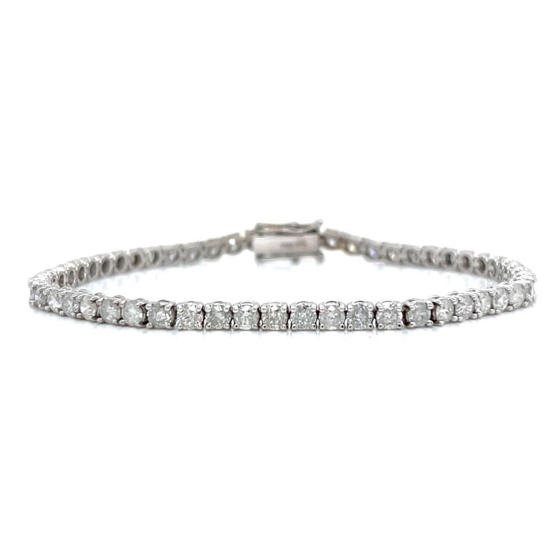 Diamond Tennis Bracelet in 18K White Gold with 5.00 Carat Total: Diamond Tennis Bracelet in 18K White Gold with 5.00 Carat Total This tennis bracelet is crafted from 18K white gold and set with approximately 5.00 carats of diamonds featuring I1-I3 clarity. The brac