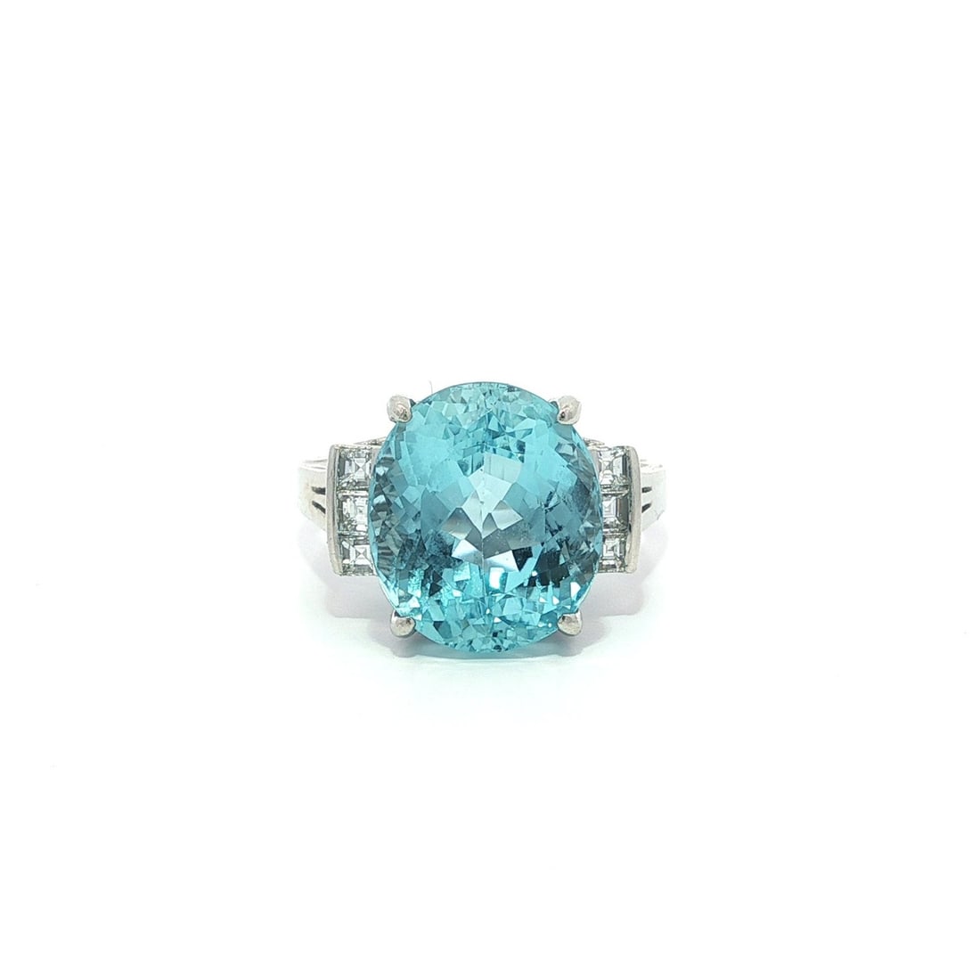 Oval Aquamarine and Diamond Accent Platinum Cocktail Ring 6.92ctw Size 6: Oval Aquamarine and Diamond Accent Platinum Cocktail Ring 6.92ctw Size 6 This platinum cocktail ring features a 6.64 carat natural oval brilliant cut aquamarine with a vibrant blue color, prong set as