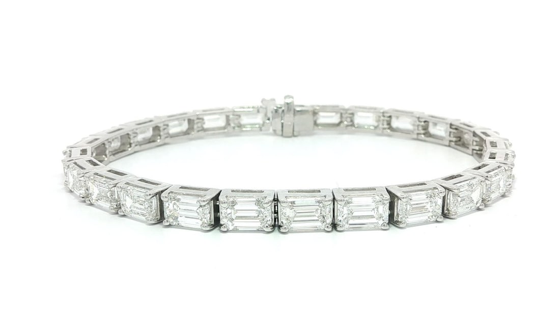Platinum Tennis Bracelet With 23.03ct Emerald Cut Lab Created Diamonds: Platinum Tennis Bracelet With 23.03ct Emerald Cut Lab Created Diamonds This substantial tennis bracelet features 23.03 carats of emerald-cut, lab-grown colorless diamonds with VVS-VS clarity, prong se