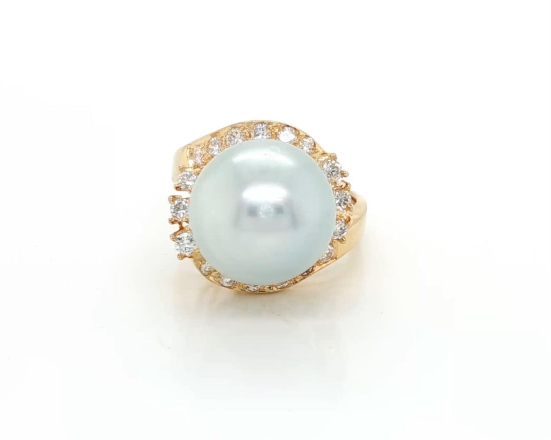 14k Yellow Gold Cocktail Ring with 12.7mm Cultured Pearl and Diamonds Size 6.5: 14k Yellow Gold Cocktail Ring with 12.7mm Cultured Pearl and Diamonds Size 6.5 This elegant cocktail ring features a large 12.7mm cultured pearl at its center, surrounded by approximately 0.75ct of sp