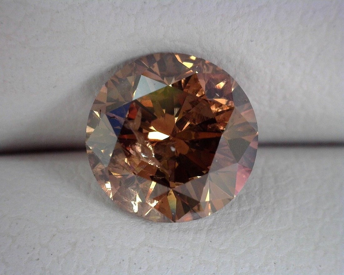 Loose Diamond - ROUND 1.09ct Brown I1: Loose Diamond - ROUND 1.09ct Brown I1 Source: Natural Shape: ROUND Carats: 1.09 Color: Brown Certification: OTHER The Diamond Depot Guarantee: All items in this auction are guaranteed to be 100% authe