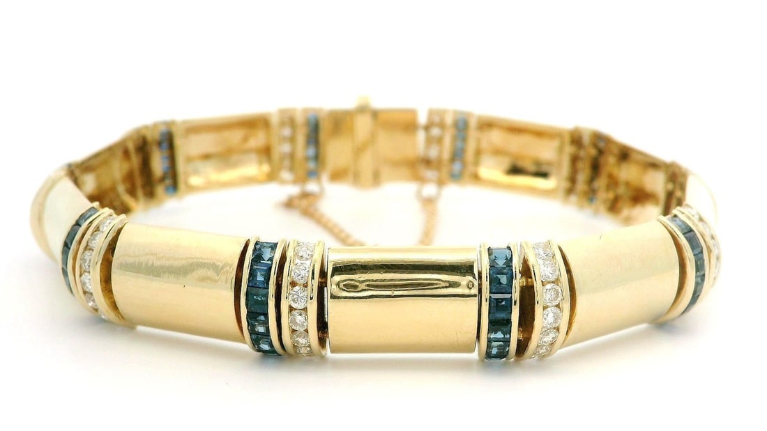14k Gold 4.75ctw Sapphire Diamond Link Bracelet Unisex: 14k Gold 4.75ctw Sapphire Diamond Link Bracelet Unisex This stunning unisex bracelet features a luxurious design crafted from 14k solid yellow gold. The alternating sections showcase a total carat wei