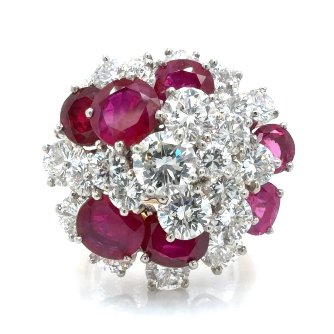 1960s Burma Ruby Diamond Ring 18K Gold Platinum by Oscar Heyman: 1960s Burma Ruby Diamond Ring 18K Gold Platinum by Oscar Heyman This Oscar Heyman ring from the 1960s is crafted in 18K yellow gold and platinum. The design is set with seven Burma rubies totaling app