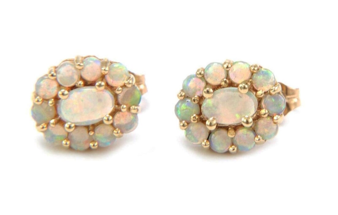 Vintage 14k Yellow Gold Fire Opal Oval Halo Stud Earrings Pair: Vintage 14k Yellow Gold Fire Opal Oval Halo Stud Earrings Pair These vintage stud earrings feature vibrant oval fire opals set in solid 14k yellow gold with an elegant halo design. The warm tone of th