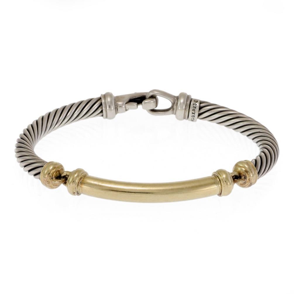 David Yurman 925 Silver 14k Yellow Gold Cable Bangle Bracelet: David Yurman 925 Silver 14k Yellow Gold Cable Bangle Bracelet This exquisite bangle bracelet by David Yurman combines the elegance of sterling silver with the warmth of 14k yellow gold. The design fea