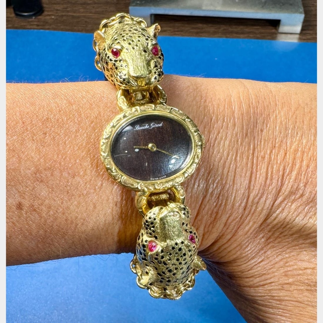 BUCHE GIROD 18K Yellow Gold Wood Bangle Watch: BUCHE GIROD 18K Yellow Gold Wood Bangle Watch This exquisite BUCHE GIROD bangle watch features a stunning combination of 18K yellow gold and wood, creating a unique and elegant accessory. Weighing 92.