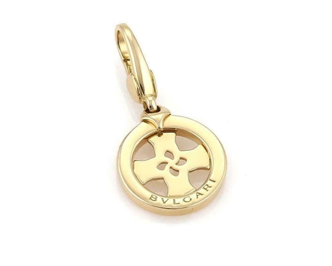 Bvlgari Tondo Pendant 18k Yellow Gold Cross Circle Italian Charm: Bvlgari Tondo Pendant 18k Yellow Gold Cross Circle Italian Charm This Bvlgari Tondo charm pendant showcases a cross and circle design crafted from 18k yellow gold. Signed by Bvlgari and made in Italy,