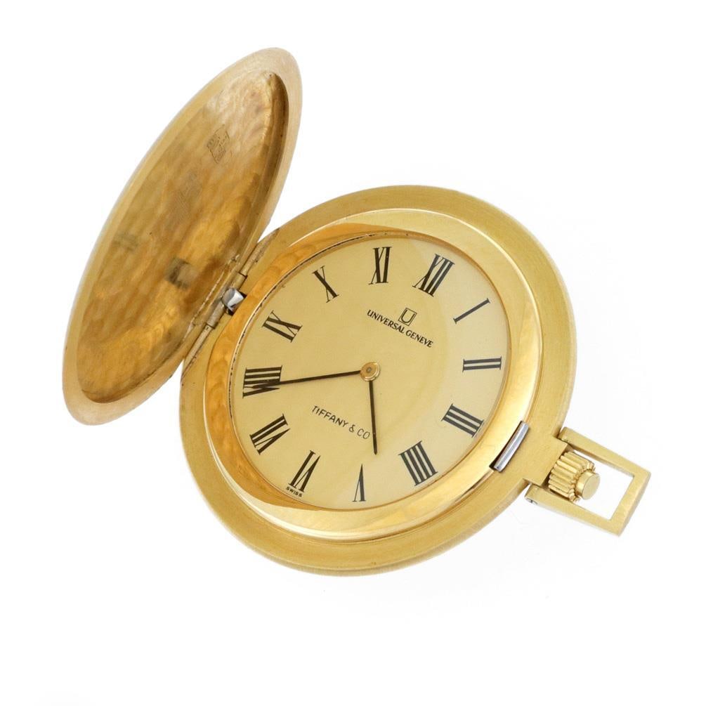 Tiffany & Co. Universal 18k Gold Manual Wind Pocket Watch 42mm: Tiffany & Co. Universal 18k Gold Manual Wind Pocket Watch 42mm This elegant men's pocket watch is an authentic Universal Geneve piece made for Tiffany & Co. The full hunter case is meticulously crafte
