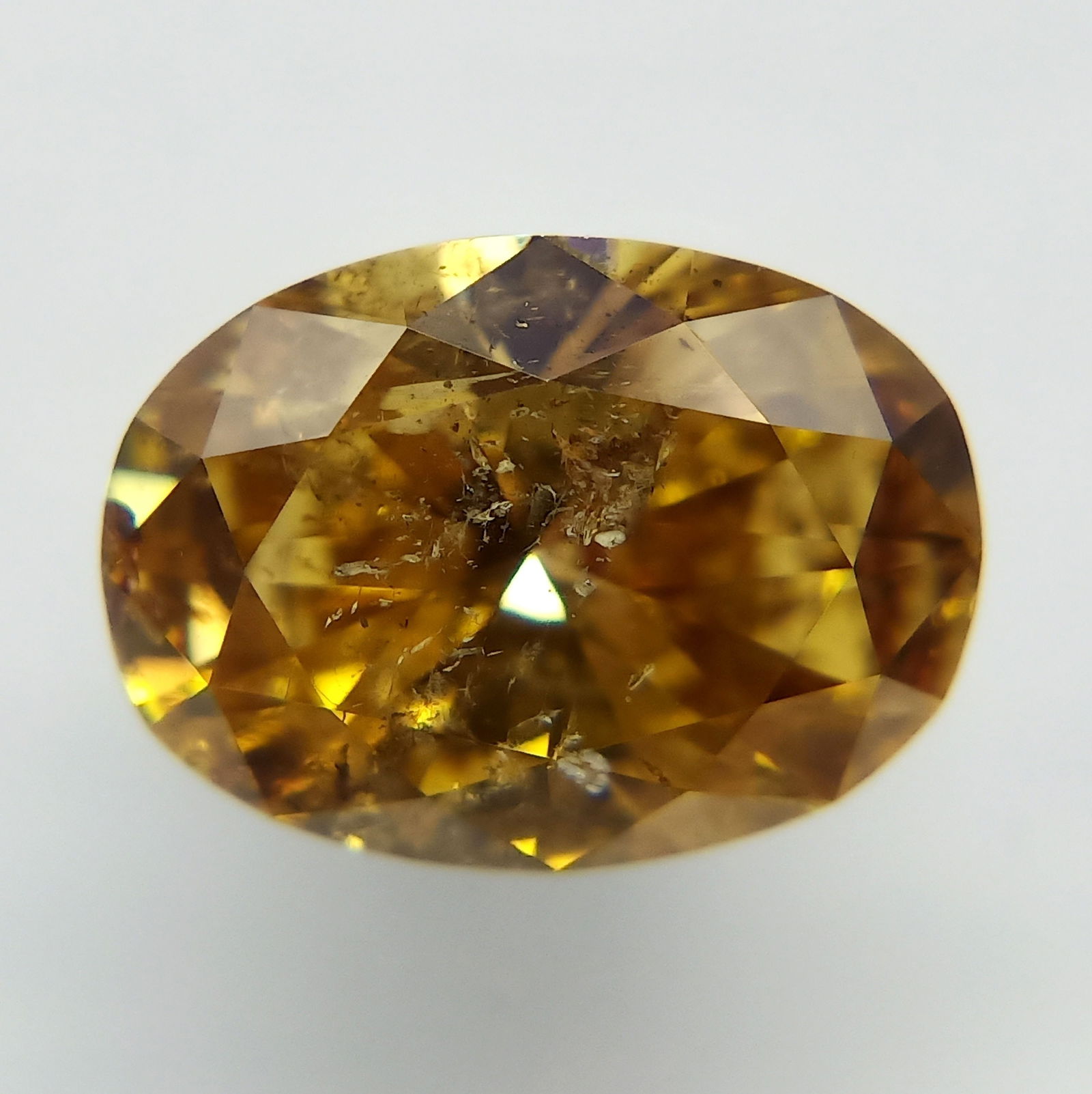 Loose Diamond - OVAL 1.2ct Fancy Deep Brownish Orangey Yellow: Loose Diamond - OVAL 1.2ct Fancy Deep Brownish Orangey Yellow Source: Natural Shape: OVAL Carats: 1.2 Color: Fancy Deep Brownish Orangey Yellow Certification: GIA Video: