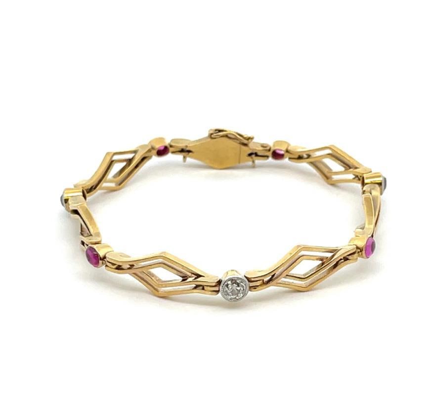 Victorian 18k Yellow Gold Bracelet with Ruby and Old Mine Cut Diamonds: Victorian 18k Yellow Gold Bracelet with Ruby and Old Mine Cut Diamonds This exquisite Victorian bracelet features a unique design crafted from 18k yellow gold. It showcases alternating double row rhom
