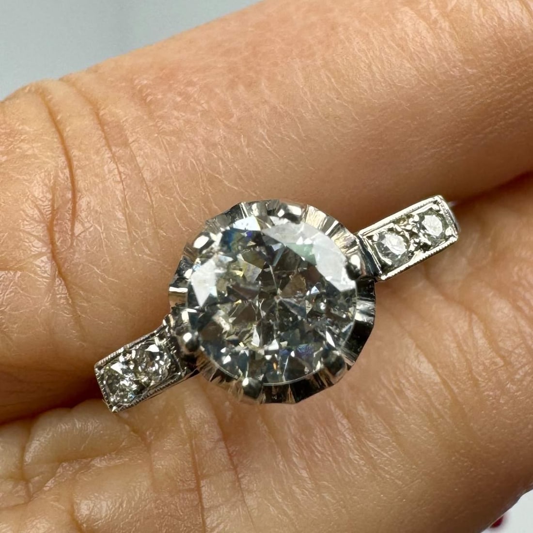 Art Deco Platinum Diamond Ring 1.11 Ct G I1 Vintage Design: Art Deco Platinum Diamond Ring 1.11 Ct G I1 Vintage Design This exquisite Art Deco diamond ring features a stunning center diamond weighing approximately 1.01 ct, showcasing a G color and I1 clarity.