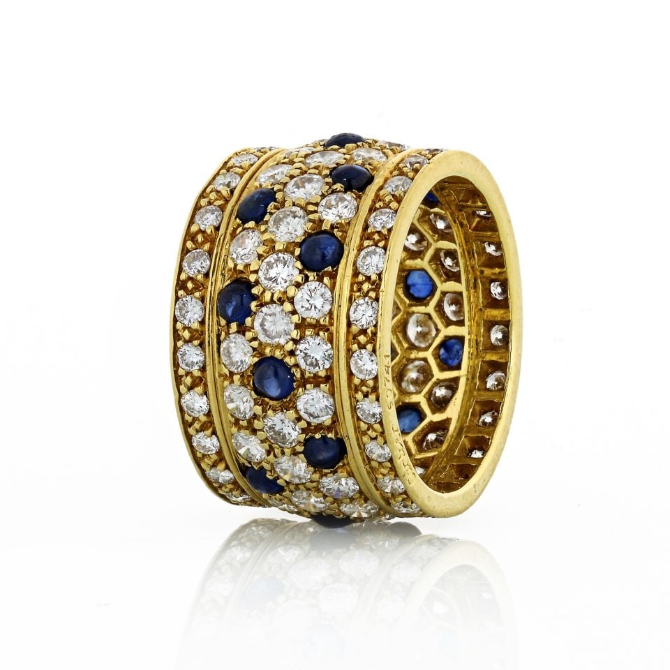 Cartier Nigeria 18K Yellow Gold Diamond Sapphire Ring with Service Papers: Cartier Nigeria 18K Yellow Gold Diamond Sapphire Ring with Service Papers This exquisite Cartier ring showcases the iconic Nigeria Panthere design, crafted from luxurious 18K yellow gold. The estate p
