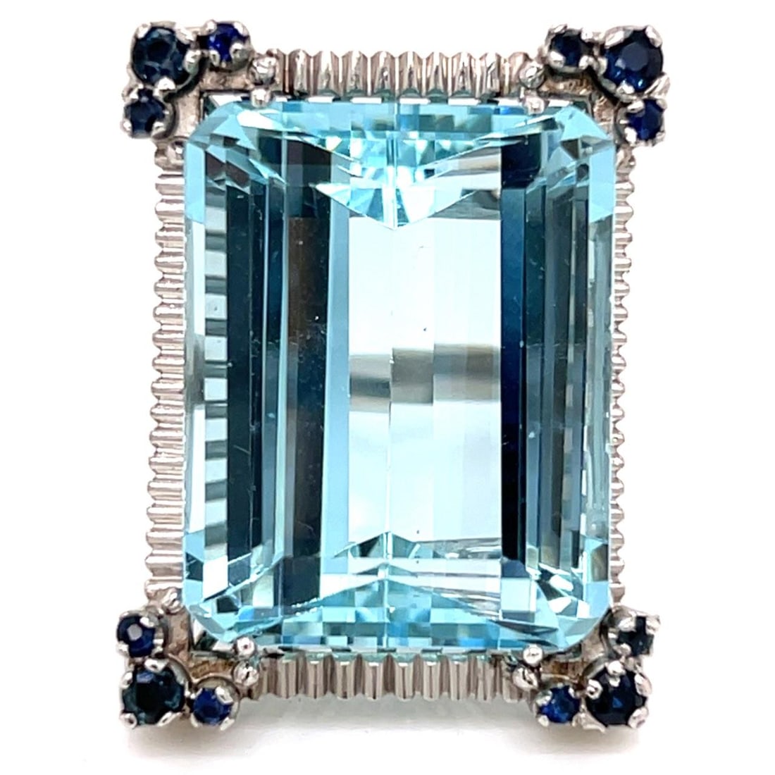 Platinum Ring with 50 Carat Aquamarine and 12 Sapphires from 1950s: Platinum Ring with 50 Carat Aquamarine and 12 Sapphires from 1950s This 1950s platinum ring features a striking approximately 50.00 ct aquamarine as its centerpiece, complemented by 12 sapphires with