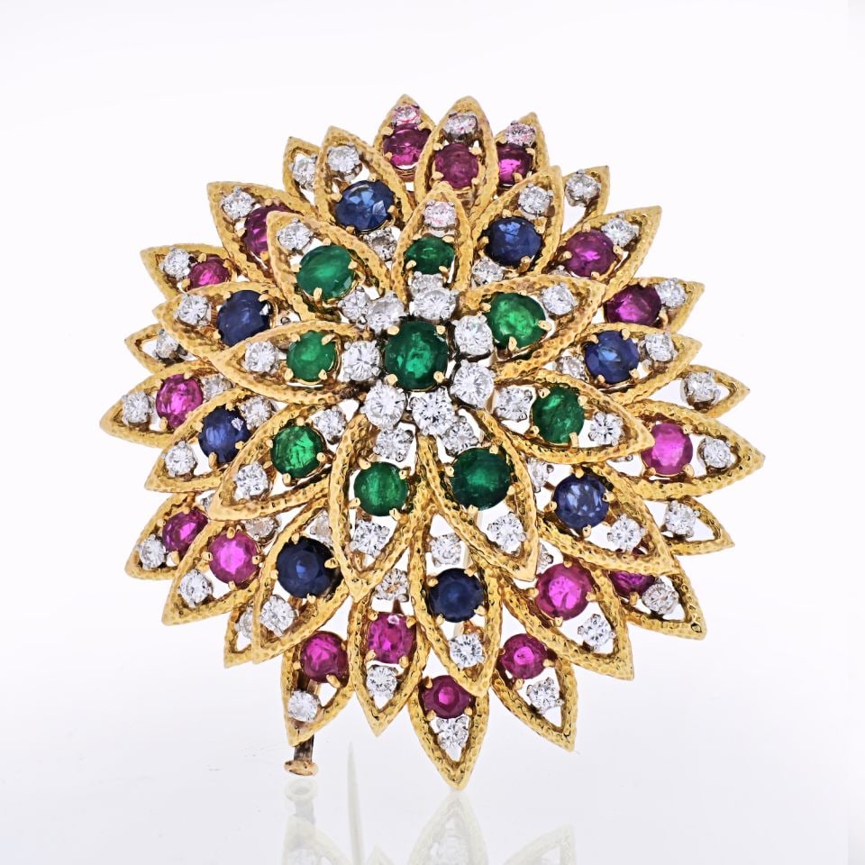 David Webb 1970s 18K Yellow Gold Multicolor Gemstone Brooch: David Webb 1970s 18K Yellow Gold Multicolor Gemstone Brooch This stunning brooch, crafted in the 1970s by David Webb, showcases a vibrant array of multicolored gemstones including diamonds, emeralds,