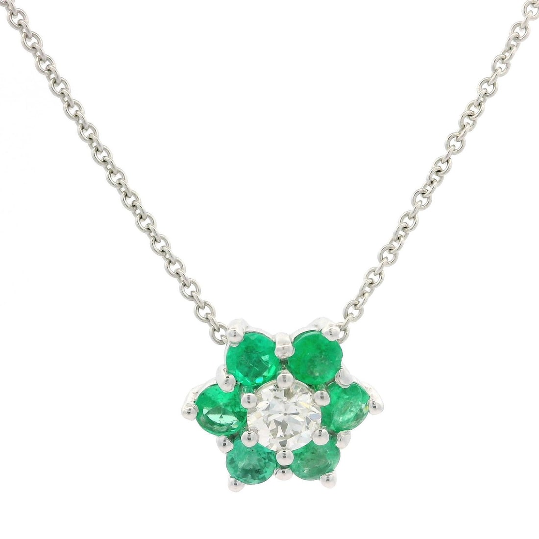 14k White Gold Emerald Diamond Flower Pendant Adjustable Necklace: 14k White Gold Emerald Diamond Flower Pendant Adjustable Necklace This exquisite pendant features a stunning flower design crafted in 14k white gold. It showcases six natural genuine emeralds, each in