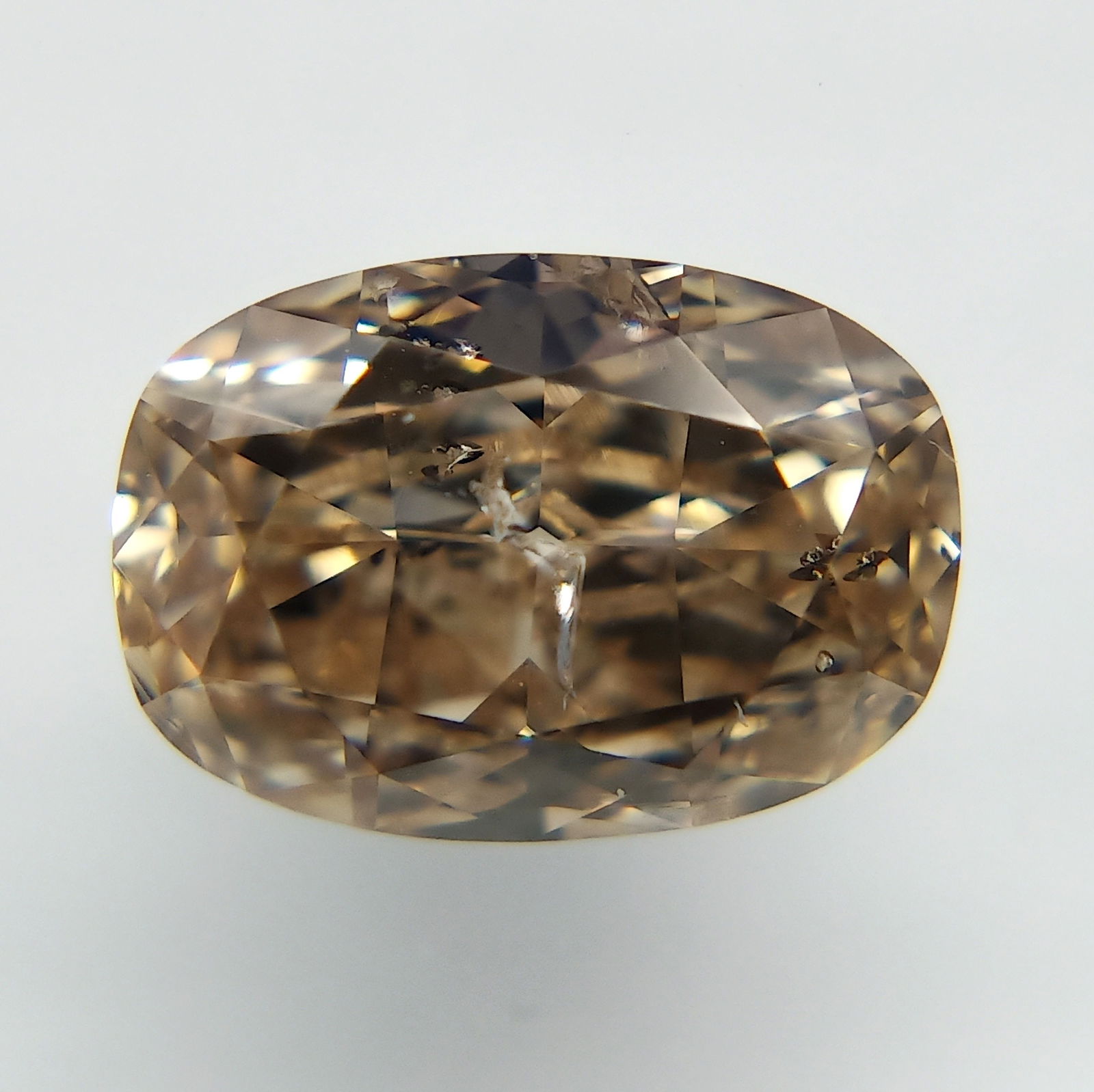 Loose Diamond - OVAL 1.06ct Fancy Orange Brown: Loose Diamond - OVAL 1.06ct Fancy Orange Brown Source: Natural Shape: OVAL Carats: 1.06 Color: Fancy Orange Brown Certification: GIA The Diamond Depot Guarantee: All items in this auction are guarante