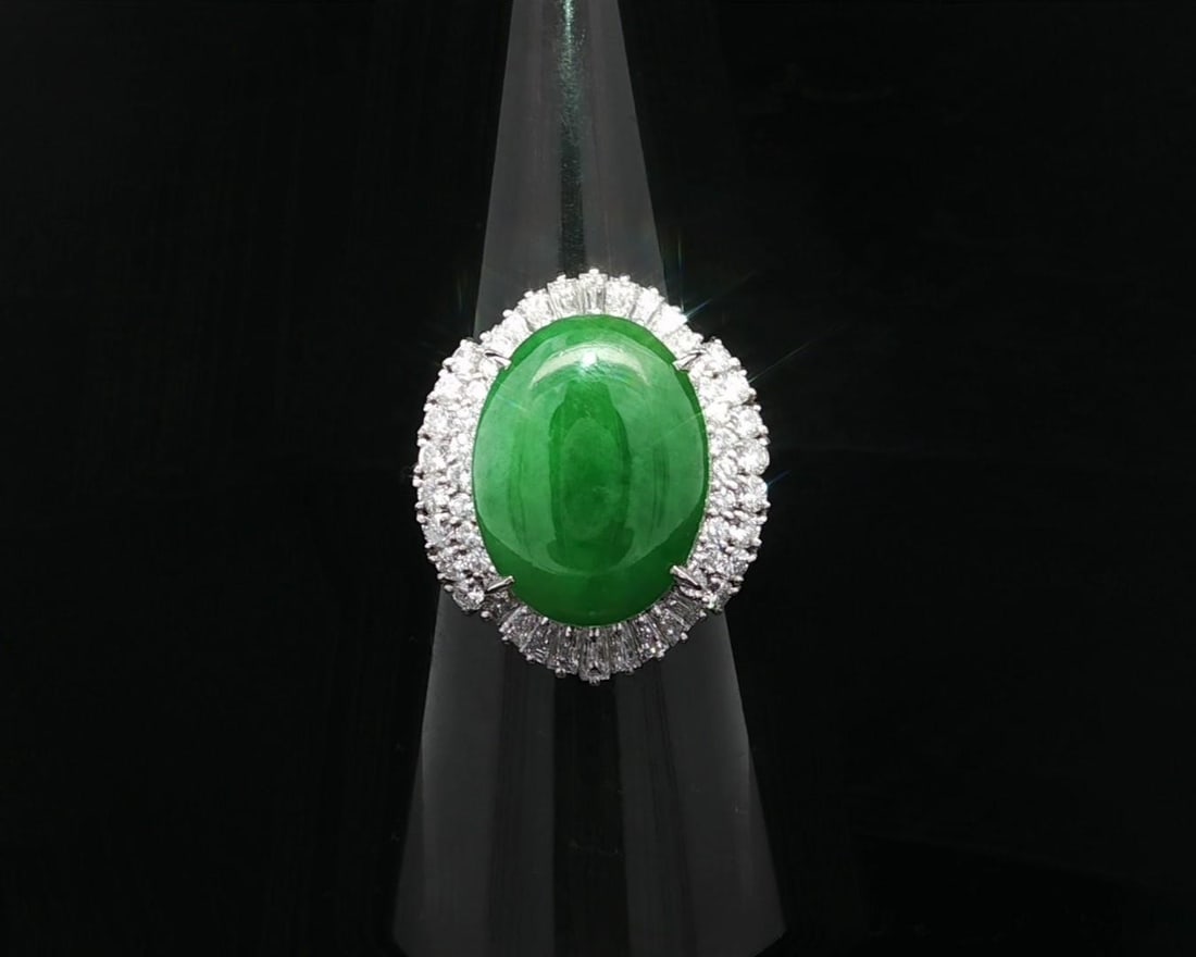 Platinum GIA Certified 8.12ct A Jade Diamond Halo Ring: Platinum GIA Certified 8.12ct A Jade Diamond Halo Ring This stunning statement ring features a captivating natural apple green jade stone, sourced from Burma. The jade is expertly cut into an oval cab