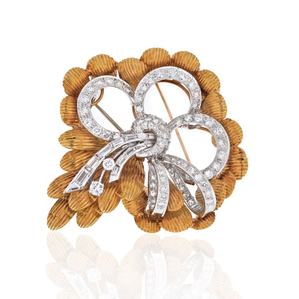 1950s Platinum 18K Yellow Gold 4 Carat Diamond Bow Brooch: 1950s Platinum 18K Yellow Gold 4 Carat Diamond Bow Brooch This exquisite brooch, crafted in the 1950s, features a stunning combination of platinum and 18K yellow gold, boasting an impressive total dia