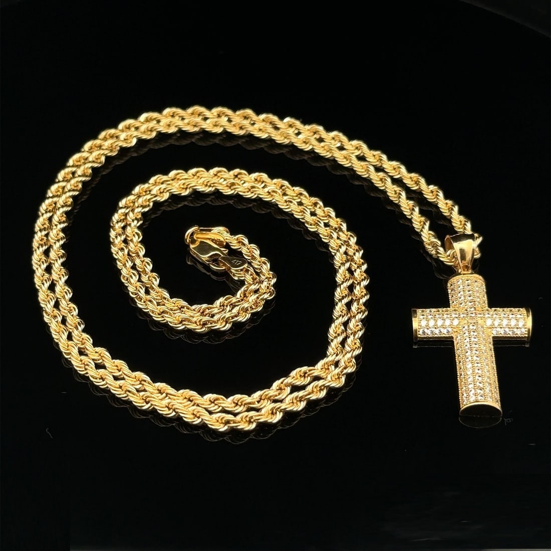 27" Yellow Gold Cross Pendant with 2.9mm Rope Chain Necklace: 27" Yellow Gold Cross Pendant with 2.9mm Rope Chain Necklace This elegant necklace features a stunning yellow gold cross pendant gracefully suspended from a durable 2.9mm rope chain. Crafted from 9k t