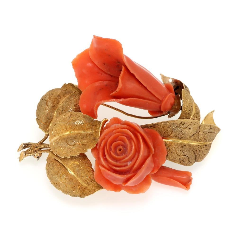 Vintage 14k Yellow Gold Coral Flower Brooch with Leaves: Vintage 14k Yellow Gold Coral Flower Brooch with Leaves This exquisite vintage brooch showcases a beautiful design featuring intricately hand-carved coral flowers styled as a tulip and rose, elegantly