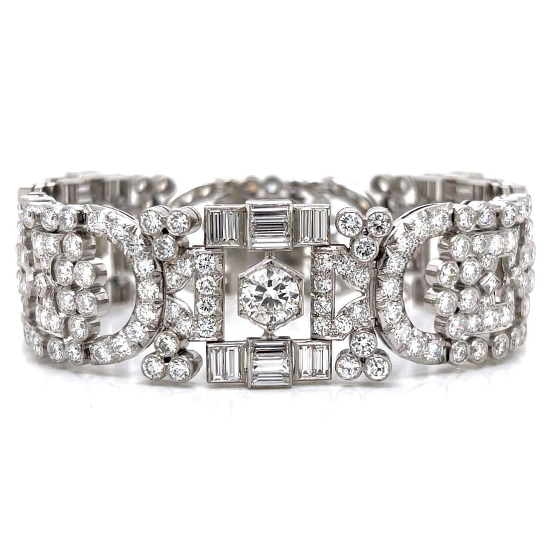 Art Deco Platinum Bracelet 26 Ct Diamond 3.40 Ct Center Stones: Art Deco Platinum Bracelet 26 Ct Diamond 3.40 Ct Center Stones This exquisite Art Deco bracelet is crafted from luxurious platinum and features a stunning total diamond weight of 26.00 carats. The pie