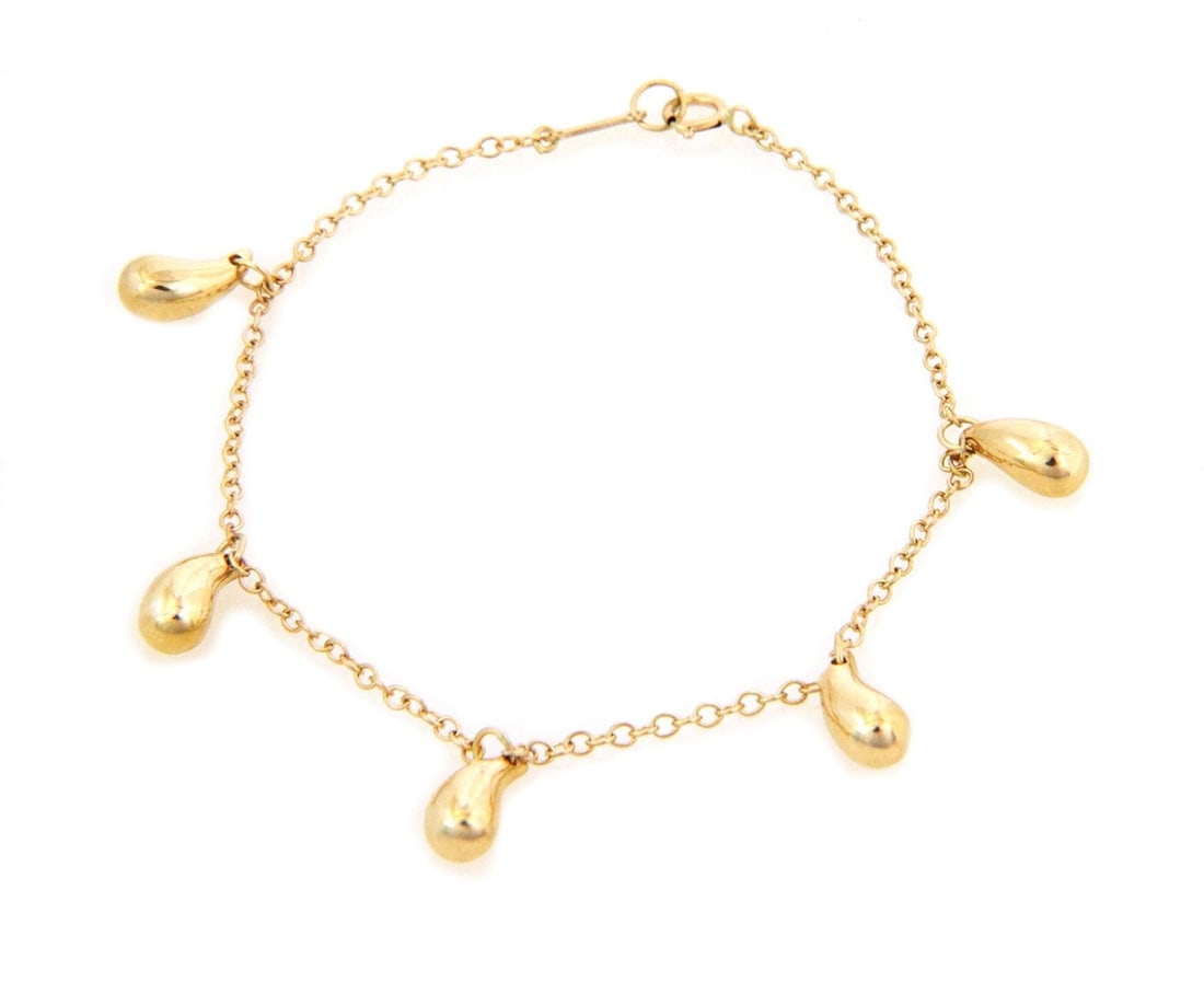 Tiffany & Co. Peretti 5 Teardrop Charm Bracelet 18k Yellow Gold: Tiffany & Co. Peretti 5 Teardrop Charm Bracelet 18k Yellow Gold This exquisite bracelet from Tiffany & Co., designed by Elsa Peretti, features five solid teardrop charms elegantly suspended along a cl