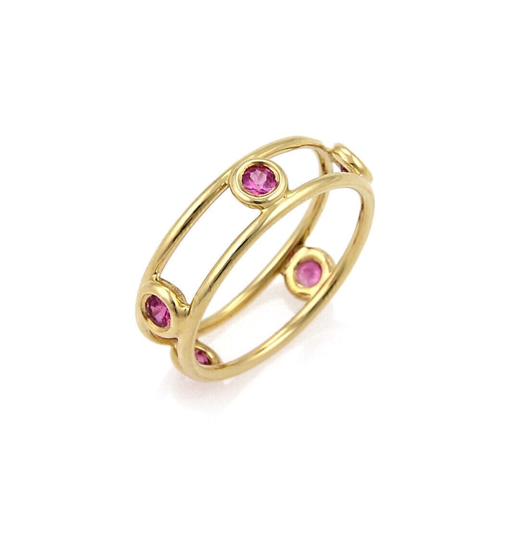 By The Yard Pink Sapphire 18k Gold Band Ring Signed Size 5.5: By The Yard Pink Sapphire 18k Gold Band Ring Signed Size 5.5 This Tiffany & Co. Pink Sapphire By The Yard band ring is crafted from 18k yellow gold and features vibrant pink sapphires. The ring is sig