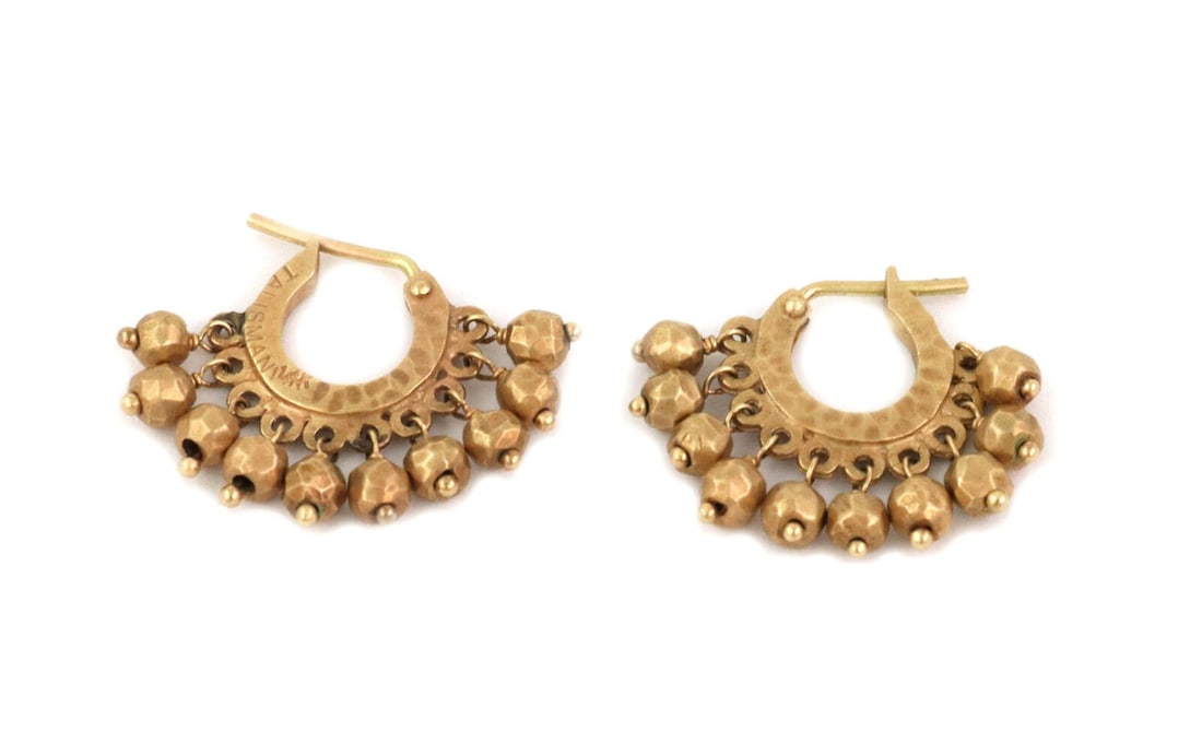 Handcrafted 14k Gold Huggie Earrings by Talisman with Hammered Bead Design: Handcrafted 14k Gold Huggie Earrings by Talisman with Hammered Bead Design These vintage huggie earrings are crafted from 14k yellow gold and feature a hand-hammered bead design. Signed by Talisman, t