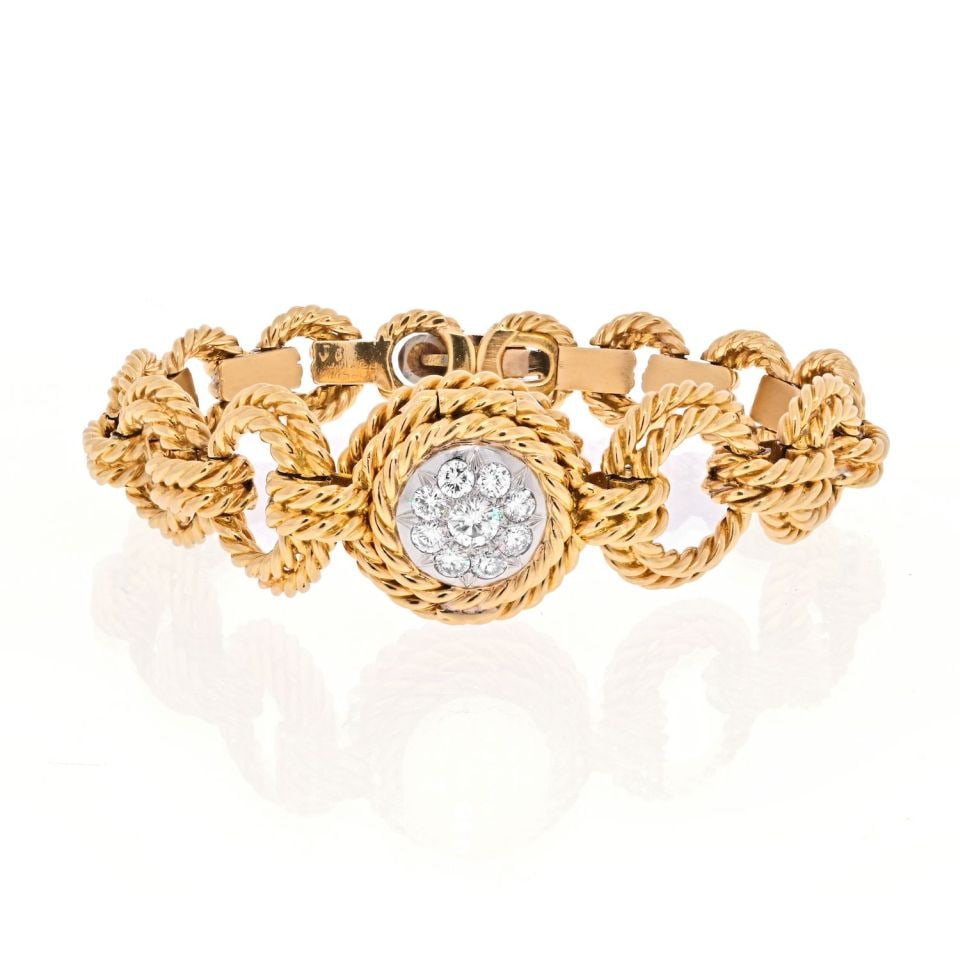 Van Cleef & Arpels 18K Yellow Gold Diamond Ropetwist Open Link Watch: Van Cleef & Arpels 18K Yellow Gold Diamond Ropetwist Open Link Watch This exquisite vintage watch by Van Cleef & Arpels features an elegant design crafted from 18K yellow gold and platinum. The piece