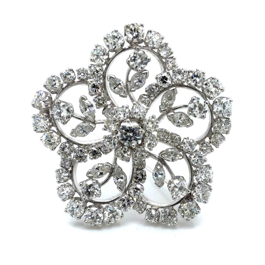 Platinum Floral Brooch with 11.60 Carats of Diamonds Circa 1950s: Platinum Floral Brooch with 11.60 Carats of Diamonds Circa 1950s This 1950s platinum flower brooch features 64 Old Mine cut diamonds totaling approximately 10.00 carats and 10 marquise cut diamonds to